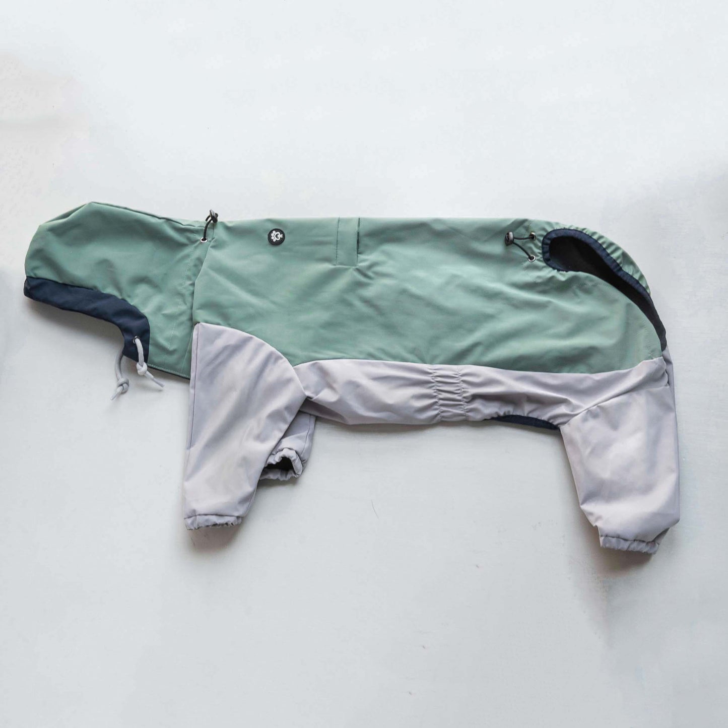 Side view of dog raincoat, highlighting fit, coverage, and waterproof outdoor protection.