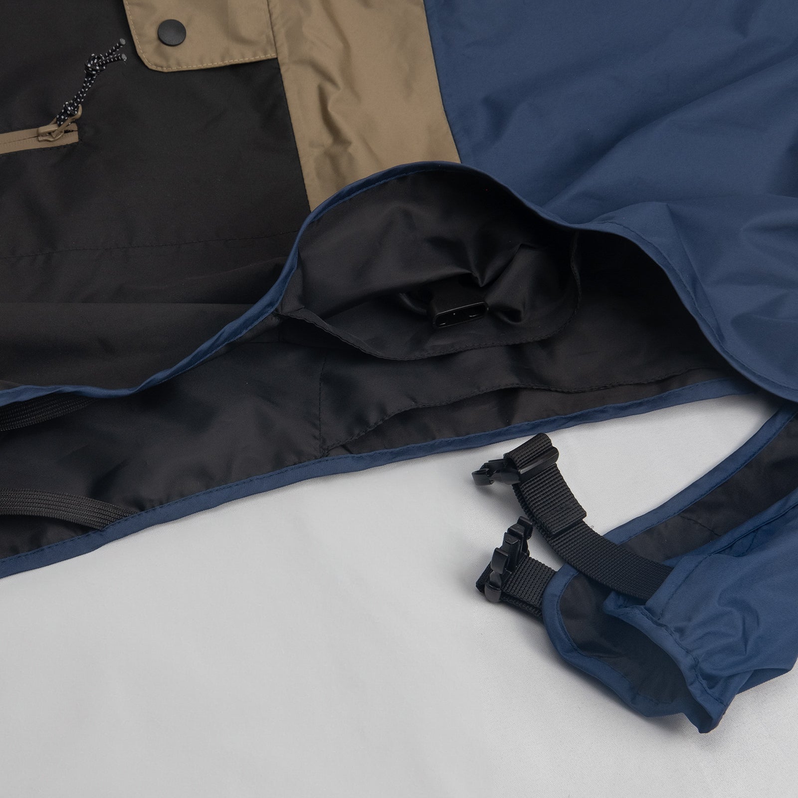 Adjustable clip-fastened chest closure on the Baja Coastline dog waterproof coat, ensuring a secure and comfortable fit for active dogs in rainy conditions.