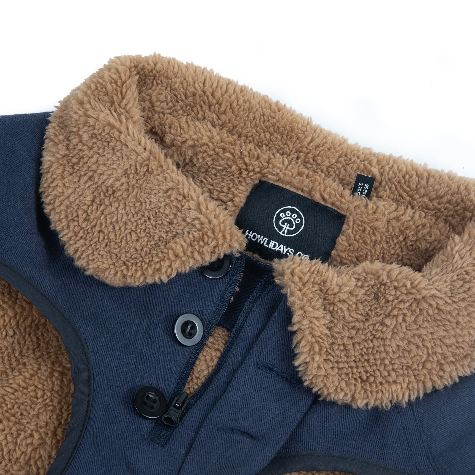 Close-up of a dog winter jacket featuring a front zipper and button closure, designed for easy wear and a secure fit.